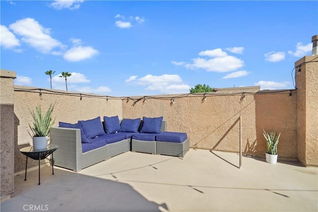 view of patio with a fenced backyard and an outdoor living space