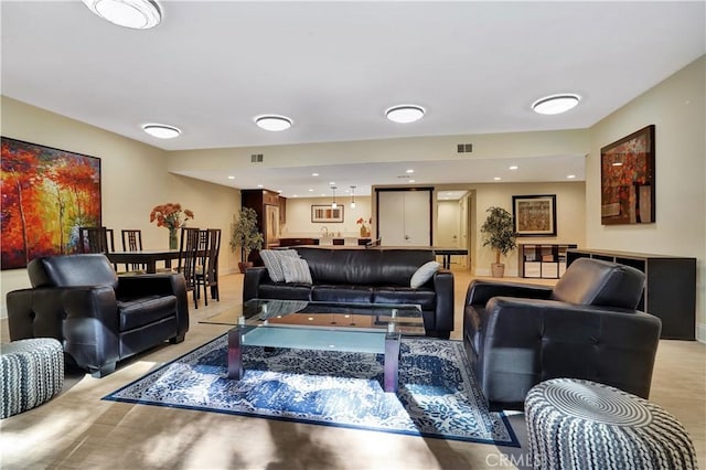 living room with visible vents and recessed lighting