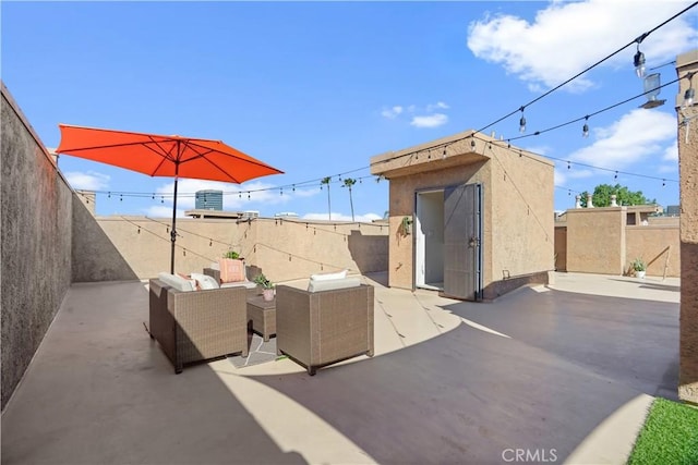 view of patio featuring a storage shed, an outdoor structure, a fenced backyard, and an outdoor living space