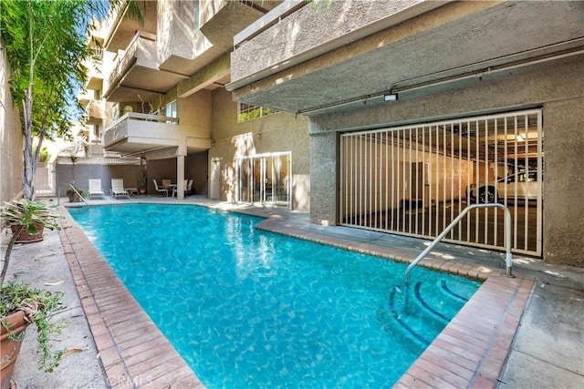 pool with a patio