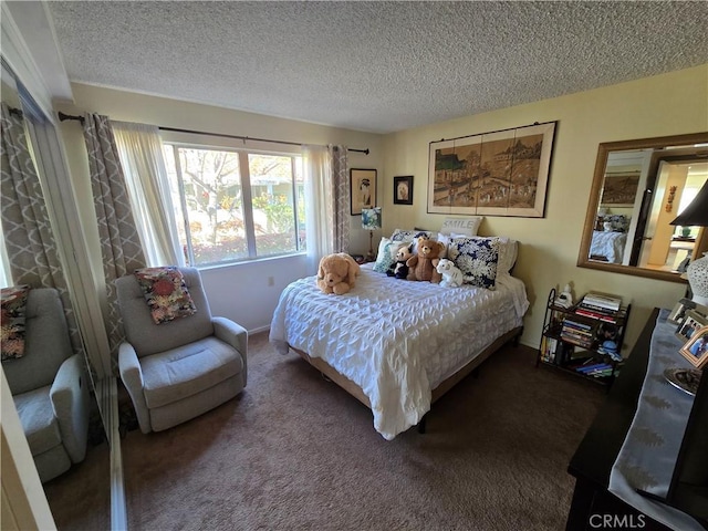 carpeted bedroom with a textured ceiling