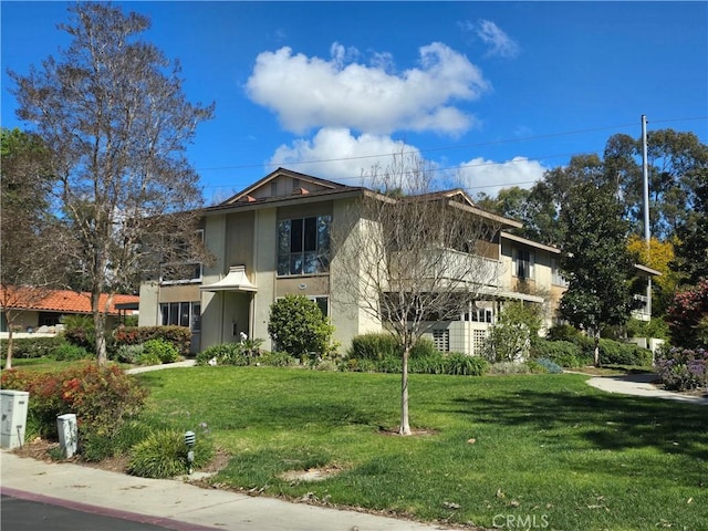 784 Via Los Altos Unit A, Laguna Woods, CA 92637 - exterior space featuring a front lawn and stucco siding