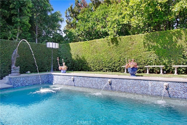 view of pool with fence