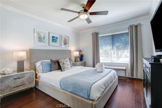 bedroom with dark wood-style flooring, a ceiling fan, and crown molding