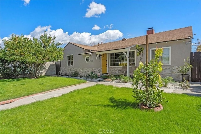 view of front of house featuring stone siding, a front lawn, and stucco siding