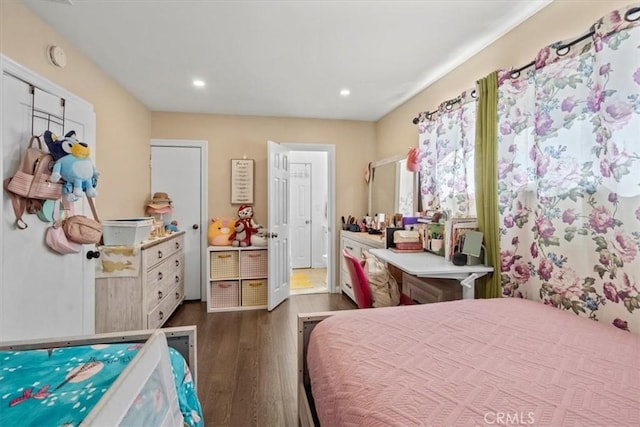 bedroom with dark wood-type flooring and recessed lighting