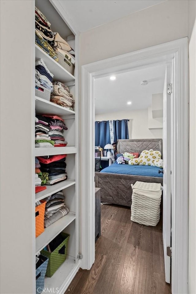 bedroom featuring dark wood finished floors