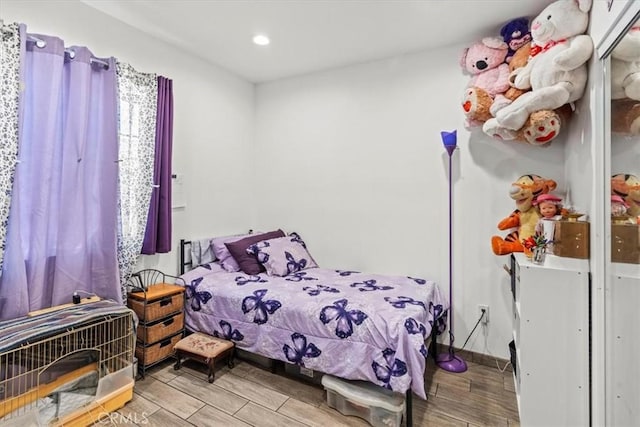 bedroom featuring baseboards, recessed lighting, and wood tiled floor