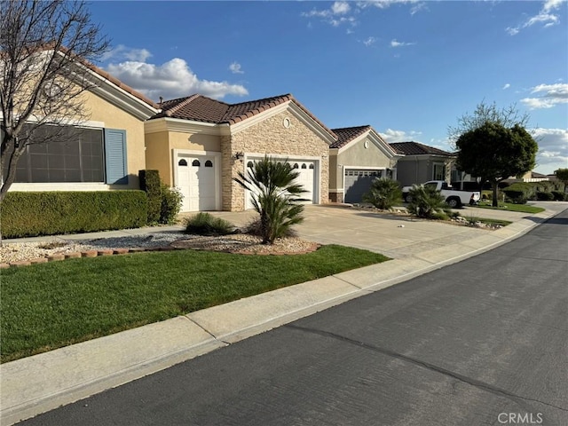 ranch-style home featuring a garage, stone siding, driveway, and stucco siding