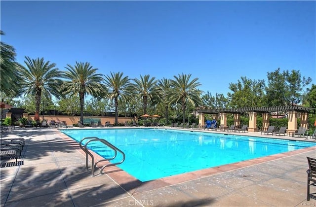 community pool featuring a patio area