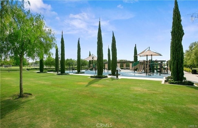 surrounding community featuring playground community and a yard