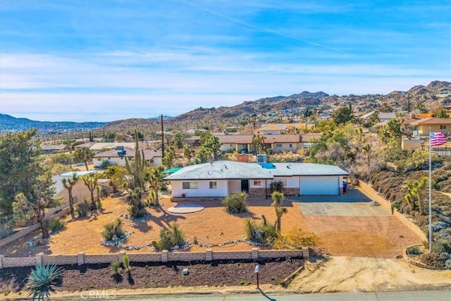 birds eye view of property with a mountain view