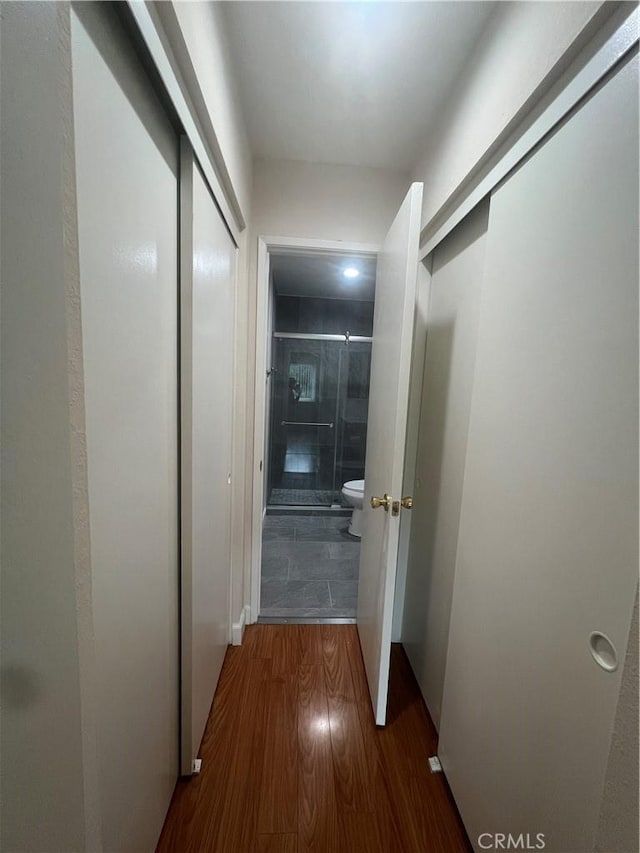 corridor with wood finished floors