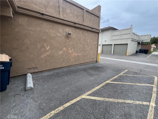 view of side of home with stucco siding