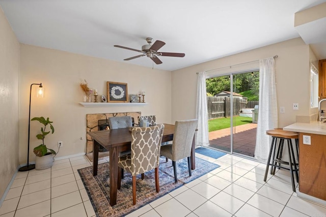 dining room featuring light tile patterned floors and a ceiling fan