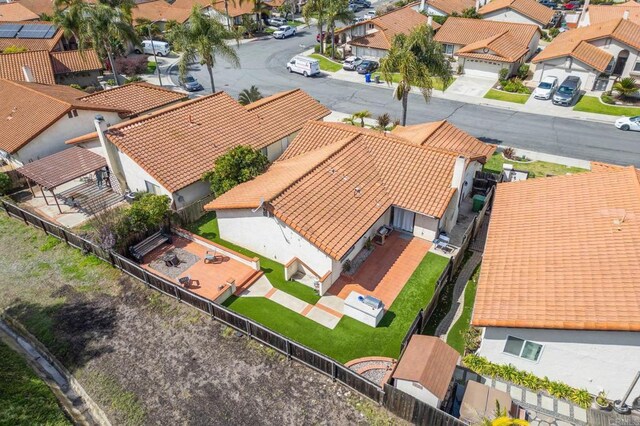 birds eye view of property with a residential view