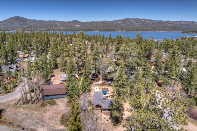 aerial view featuring a water and mountain view