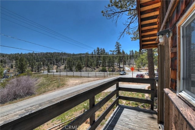 exterior space featuring a wooded view