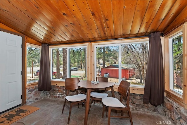 sunroom with lofted ceiling and wooden ceiling