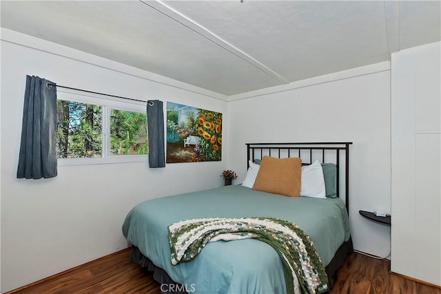 bedroom featuring wood finished floors