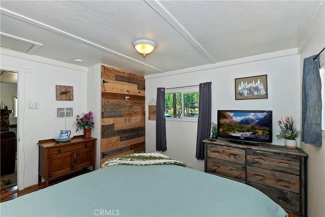 bedroom featuring visible vents and attic access