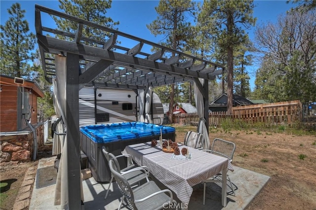 view of patio / terrace featuring outdoor dining space, fence, and a pergola