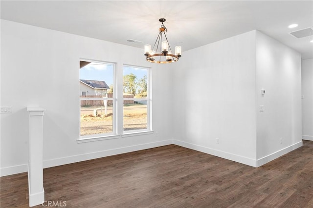 unfurnished dining area with visible vents, baseboards, and dark wood-type flooring