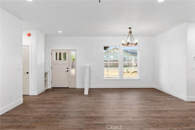 foyer entrance featuring a healthy amount of sunlight, baseboards, dark wood-style flooring, and recessed lighting