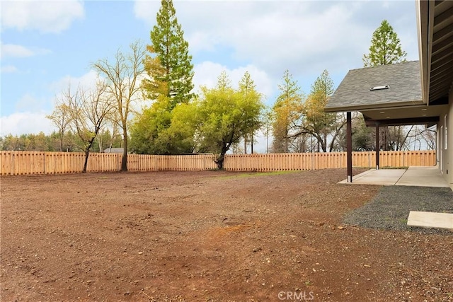 view of yard with a patio area and a fenced backyard