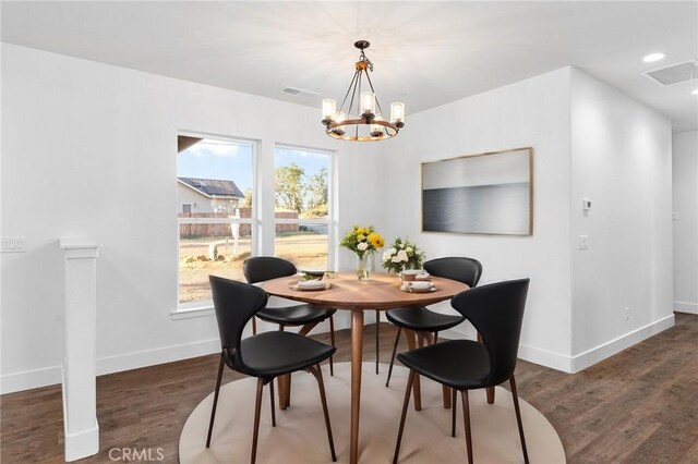 dining room with recessed lighting, wood finished floors, visible vents, baseboards, and an inviting chandelier