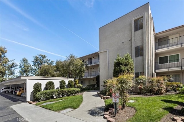 view of property with covered parking