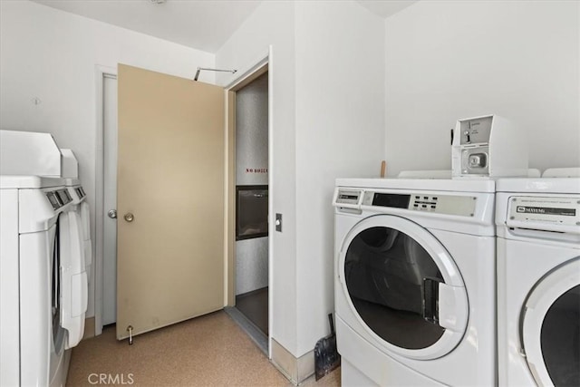 clothes washing area with washer and dryer