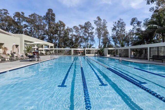 community pool with a patio area