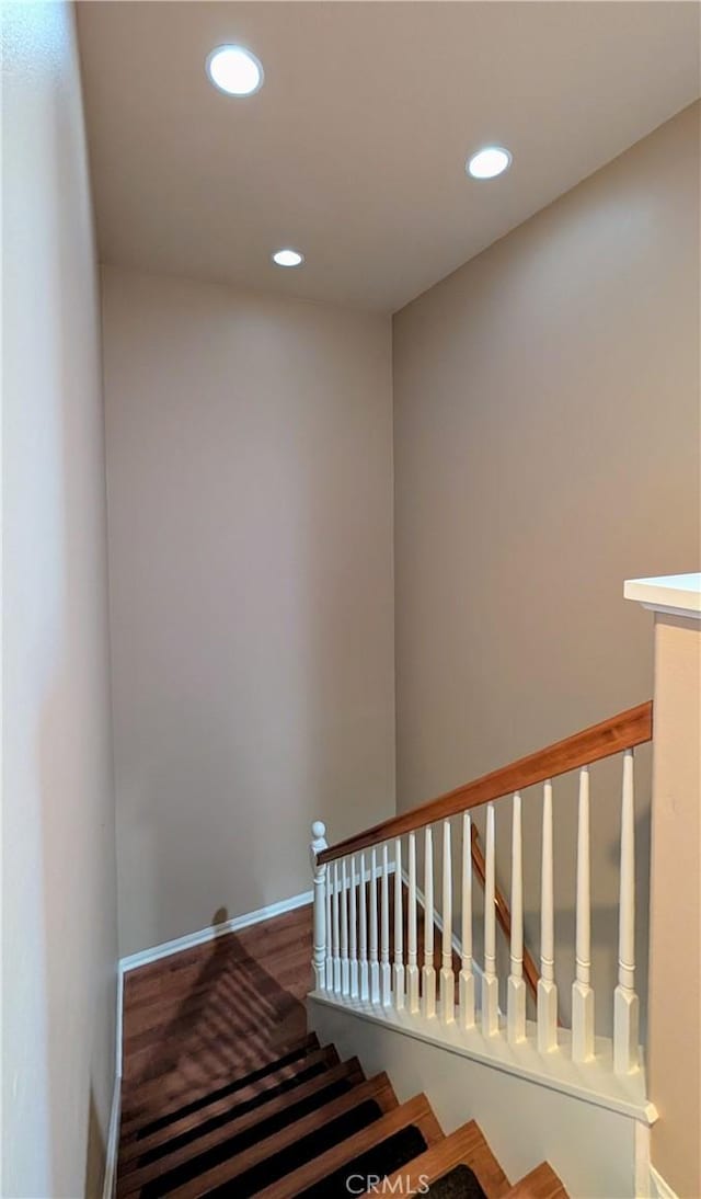 stairs featuring recessed lighting