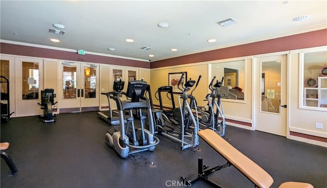 workout area featuring recessed lighting, visible vents, baseboards, and french doors