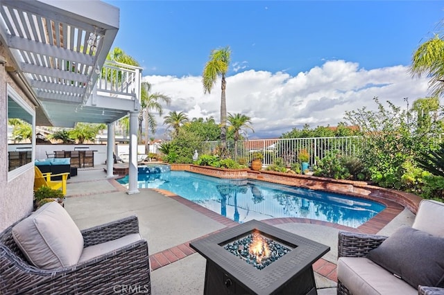 view of swimming pool featuring a fenced in pool, an outdoor living space with a fire pit, a pergola, and fence