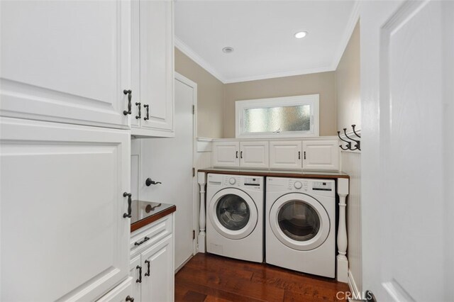 laundry area with recessed lighting, cabinet space, ornamental molding, dark wood-type flooring, and washer and dryer