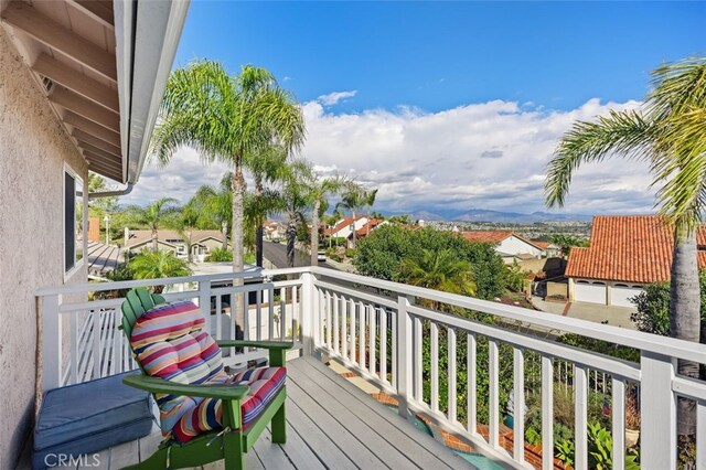 wooden terrace with a residential view