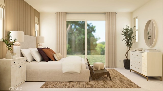 bedroom featuring light carpet and access to outside