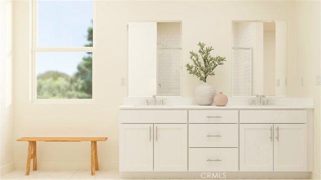 bathroom featuring a sink and double vanity