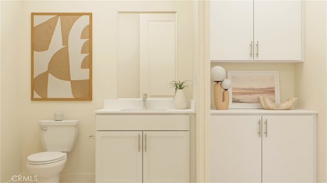 bathroom with toilet, vanity, and baseboards