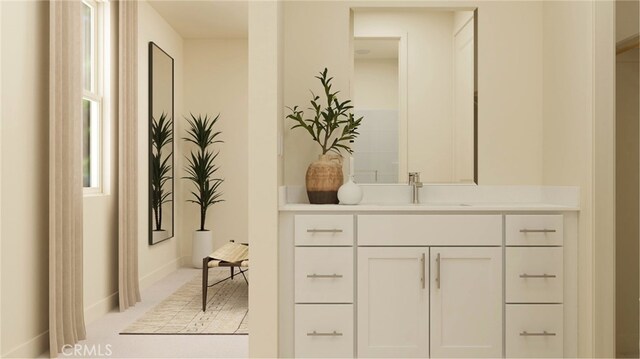 bathroom featuring baseboards and vanity