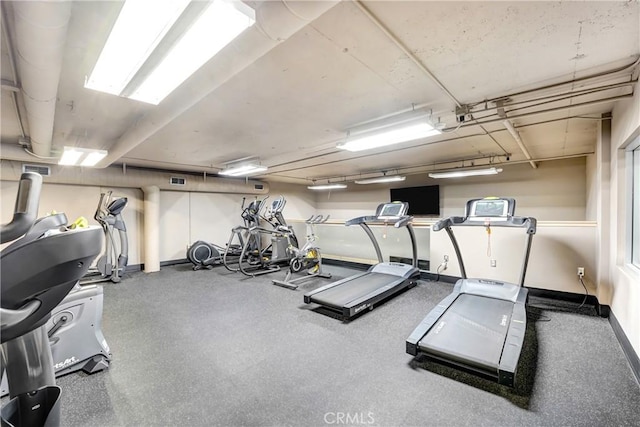 exercise room with baseboards