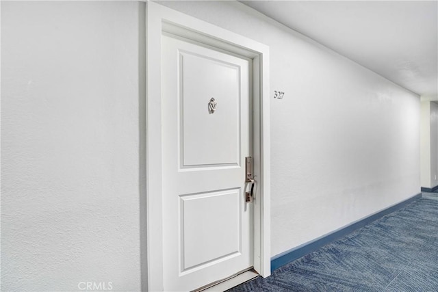 entrance to property featuring stucco siding