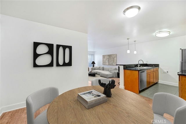 dining space featuring baseboards