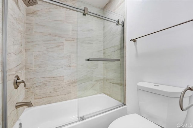 full bath featuring toilet and combined bath / shower with glass door