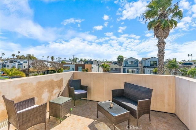 view of patio / terrace featuring a balcony and a residential view