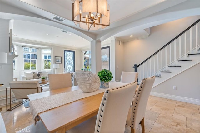 dining room featuring stairway, visible vents, a chandelier, and ornamental molding