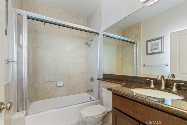 bathroom featuring vanity, toilet, and bathing tub / shower combination