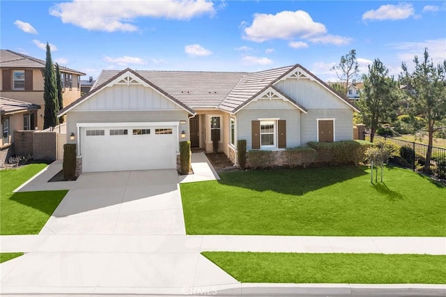 view of front facade with fence, board and batten siding, concrete driveway, a front yard, and a garage